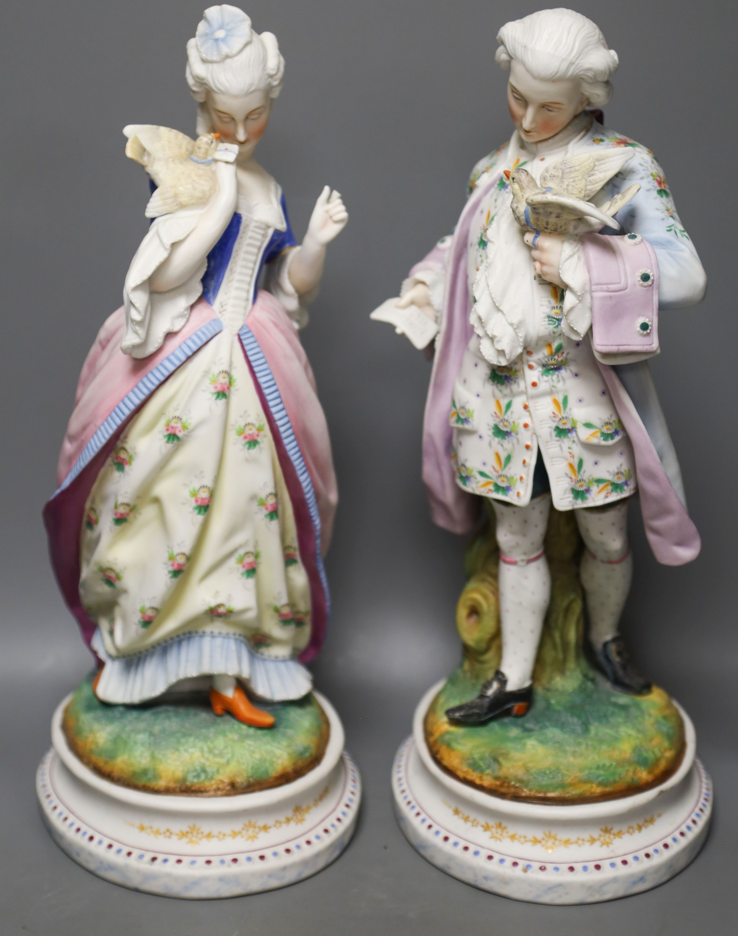 A pair of 19th century French bisque figures of a lady and gentleman 37cm